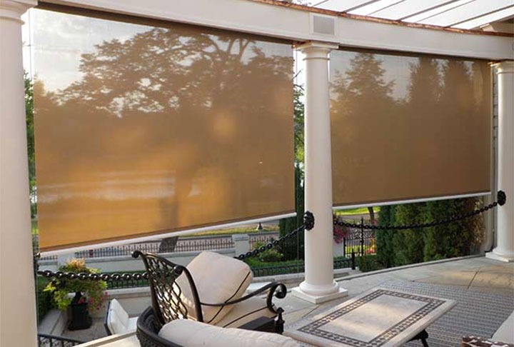 Sunesta Sunroll screens installed on a patio.