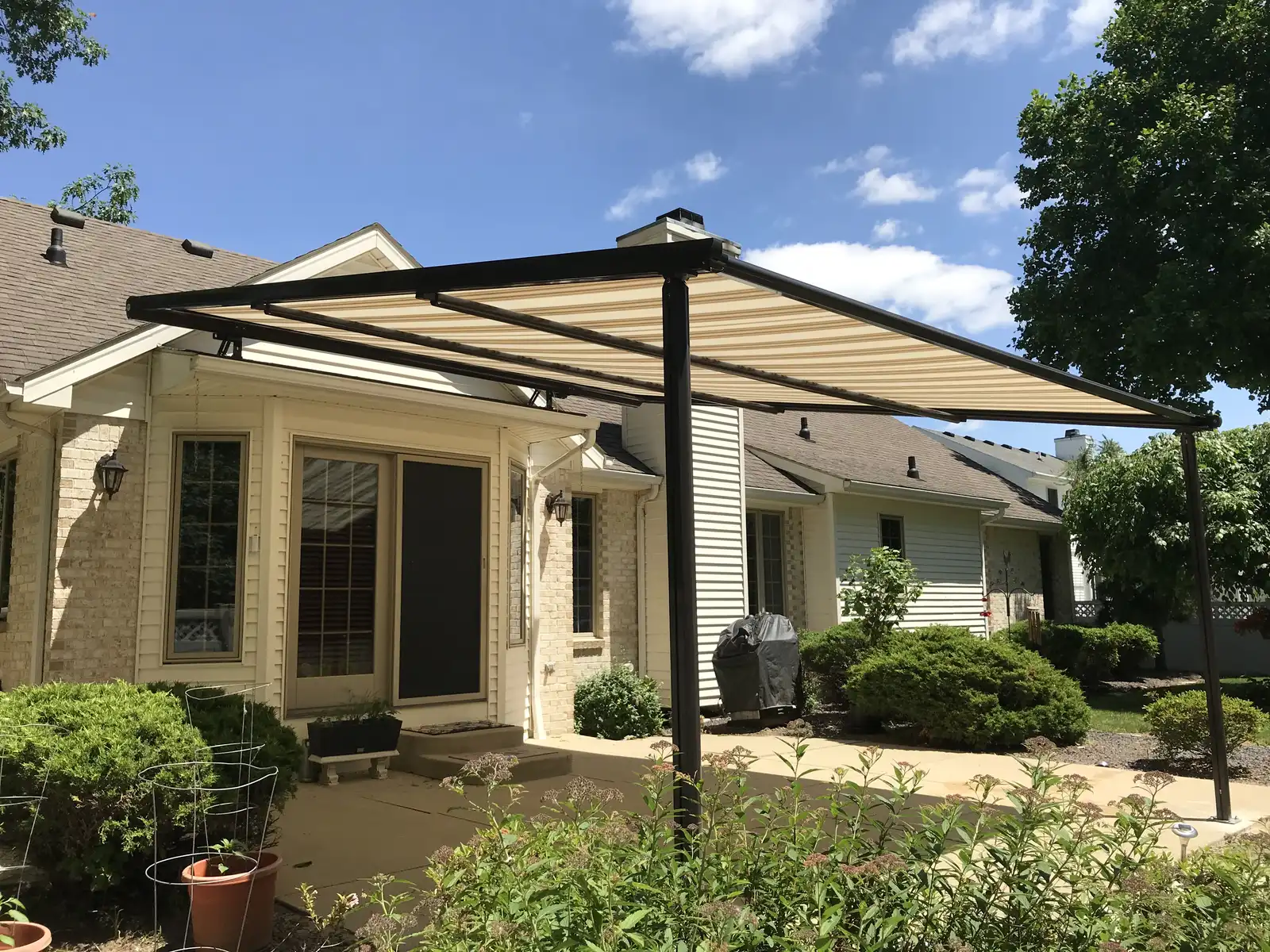 A Sunesta courtyard shelter over a patio