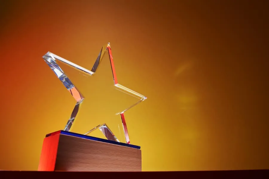 A crystal star award on a pedestal